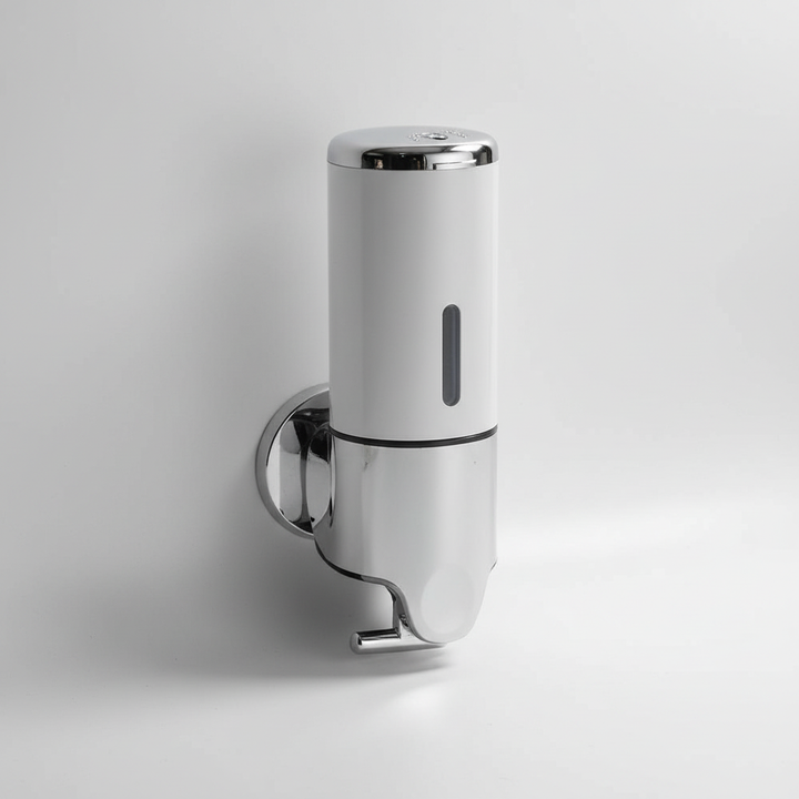 Hand pressing SoapGlide wall mounted soap dispenser, showing easy dispensing for improved hygiene.