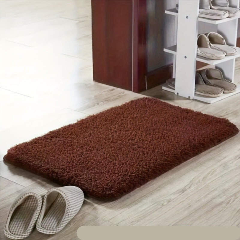 Elegant soft bath mat with geometric design, non-slip, absorbent, and comfortable.