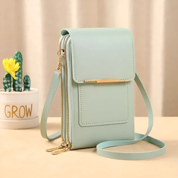 Side view: Sleek women's water-resistant leather crossbody bag, perfect for daily essentials.