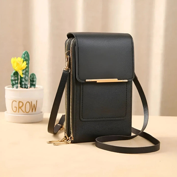 Anti-theft zipper on secure women's leather shoulder bag; SafeTouch protection.