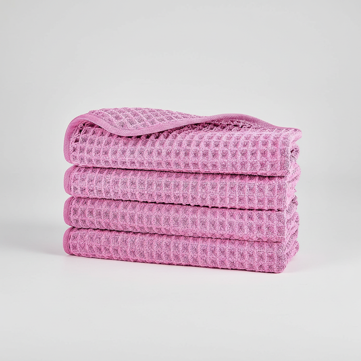 Assortment of microfiber waffle weave washcloths in various neutral colors, soft and quick-dry