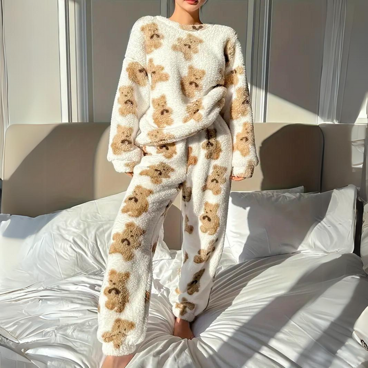 Soft velvet women's pajama set featuring a cute bear print, ideal for cozy sleepwear or comfortable loungewear.
