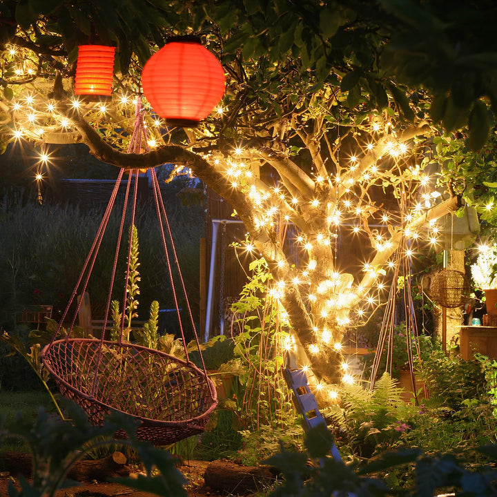 SoliGlow solar powered LED string lights illuminating a garden path at dusk, outdoor decor.