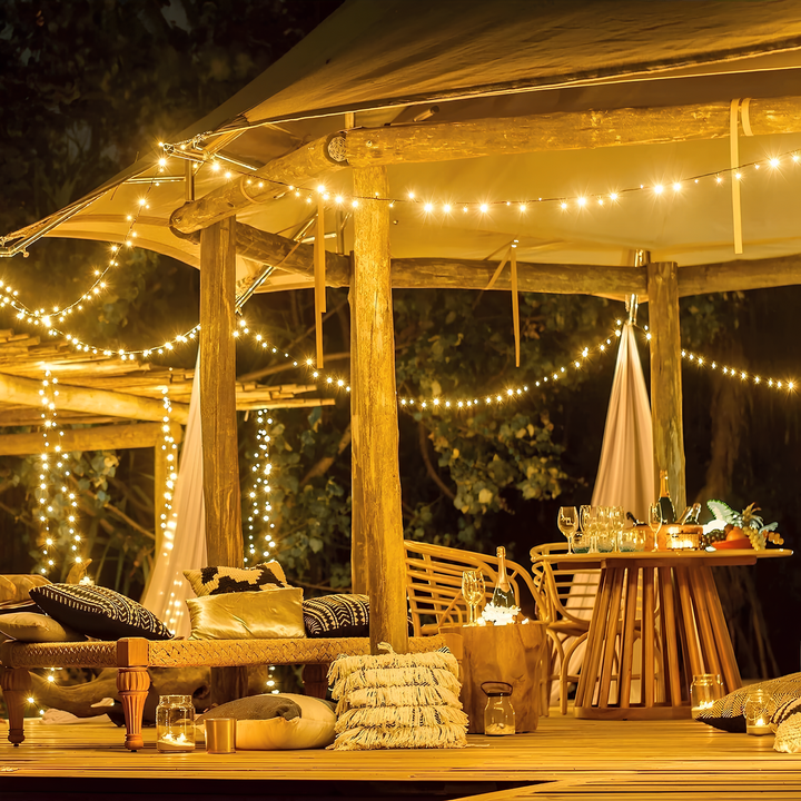 SoliGlow outdoor LED string lights creating a warm ambiance in a backyard, garden decor.
