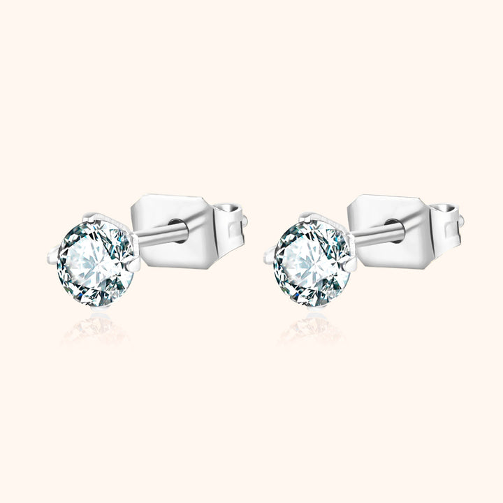 Women's fashion mini earrings on ear. Sparkling cubic zirconia adds a subtle, elegant touch.
