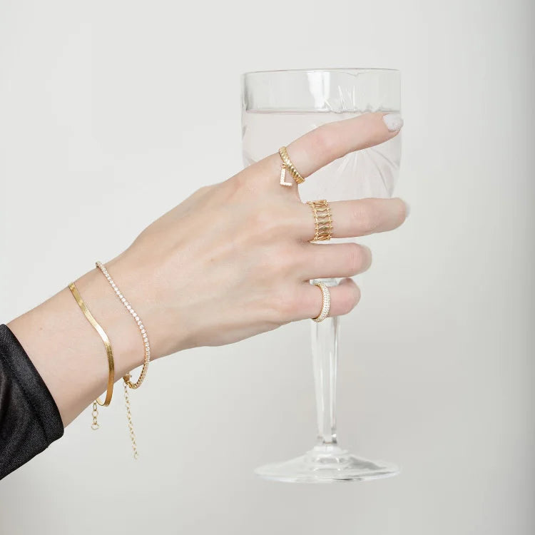Sparkling gold-plated iced bracelet for women. Elegant fashion accessory, perfect gift for her.
