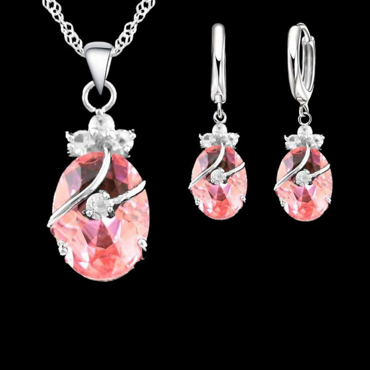 Sparkling sterling silver crystal necklace and matching earrings set for women, elegant jewelry gift.