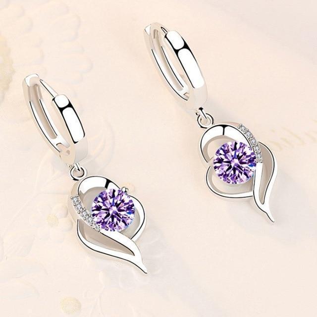 High-quality sterling silver flower earrings for women, adorned with sparkling zirconia stones. Elegant floral jewelry.