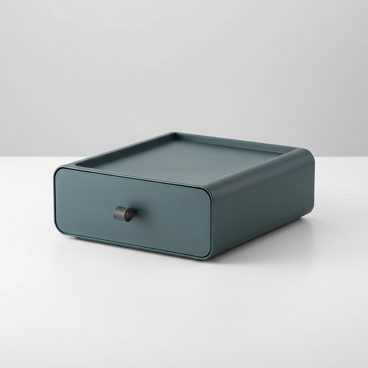 Modern stackable drawer box, white plastic, keeping small items neatly stored on a desk