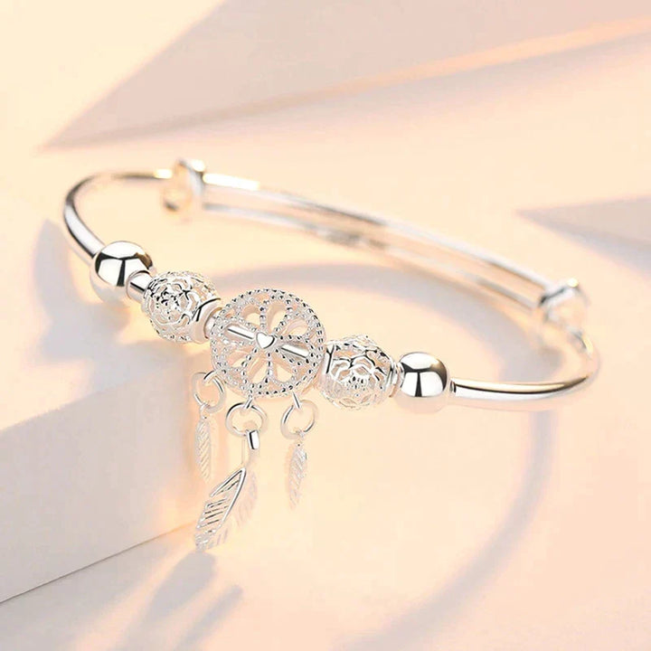 Delicate sterling silver dreamcatcher bracelet, adjustable for a perfect bohemian look.