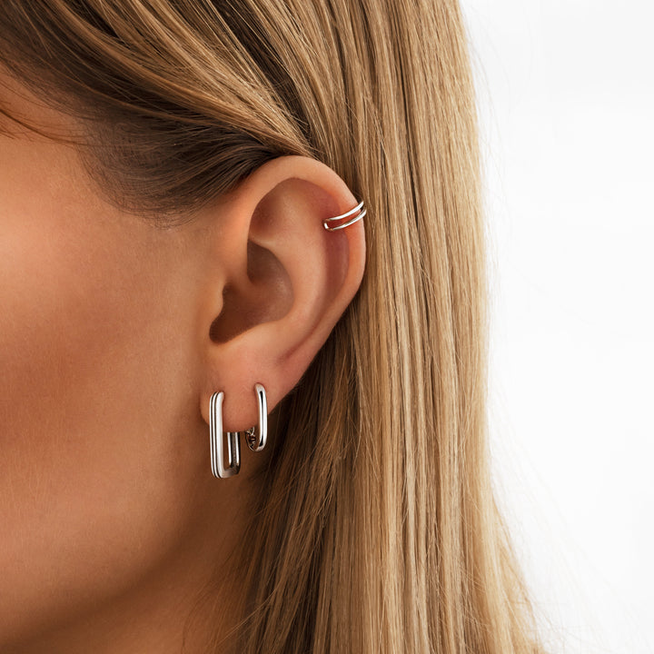 Modern gold rectangular clip-on earrings for women. Minimalist non-pierced accessory, perfect for a chic everyday look.
