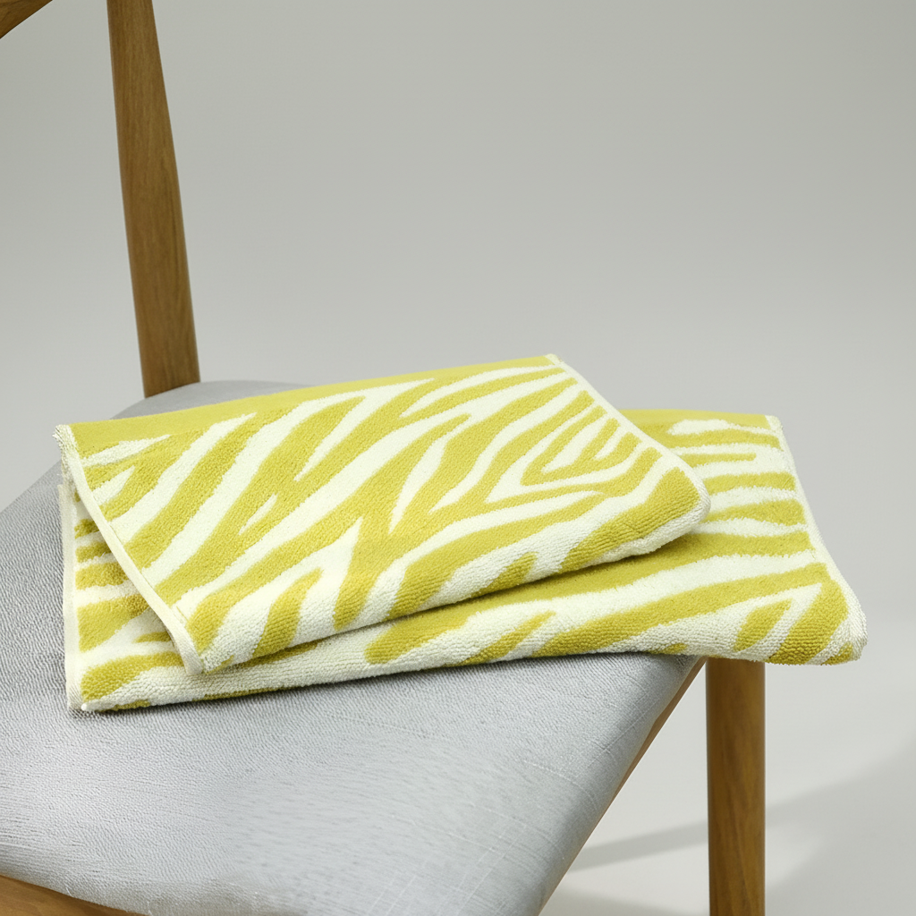 Hypoallergenic striped cotton hand towel in a spa setting, soft and gentle on skin