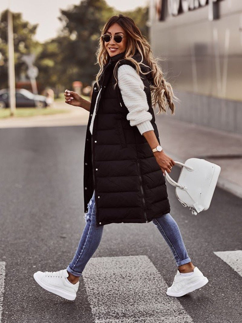 Warm knee-length padded vest for women, ideal autumn fashion & winter outerwear piece.