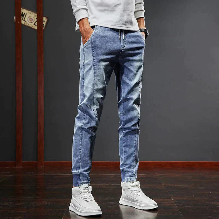 Stylish blue slim fit men's denim jeans. Comfortable, durable casual pants for modern men's everyday fashion.