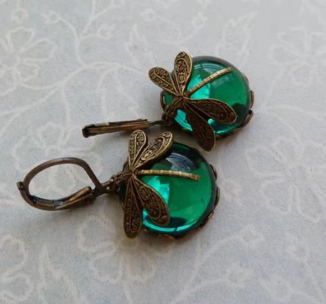 Elegant women's antique gold drop earrings with sparkling crystal accents, perfect for any outfit.