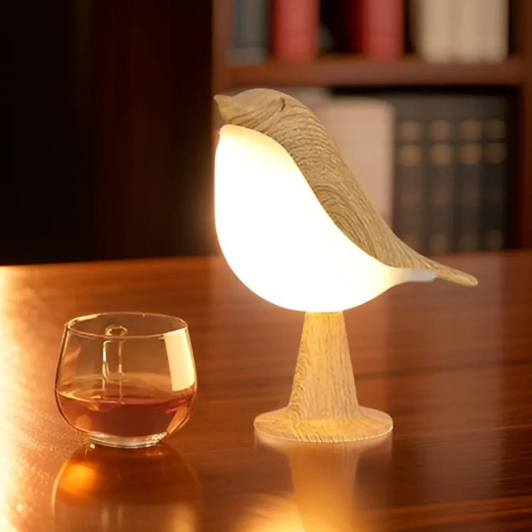Unique FeatherGlow LED bird lamp providing ambient light with touch dimming & aromatherapy diffuser.