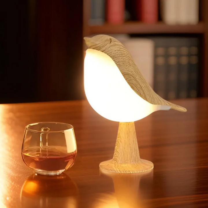 Unique FeatherGlow LED bird lamp providing ambient light with touch dimming & aromatherapy diffuser.