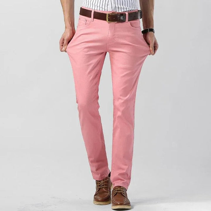 Men's vibrant pink chino pants, comfortable cotton blend stretch, regular fit for stylish everyday looks.