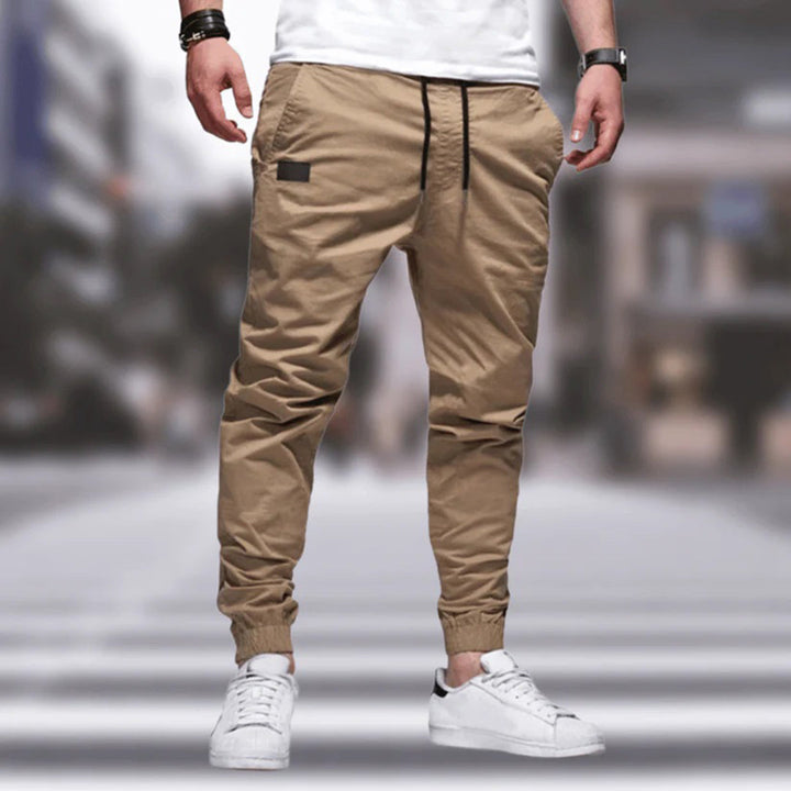 Comfortable polyester men's utility cargo pants, ideal for outdoor activities, casual looks & streetwear.