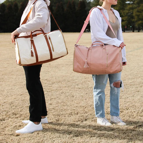 Organized women's travel duffel with separate garment compartment & shoe pockets for efficient, stylish packing.