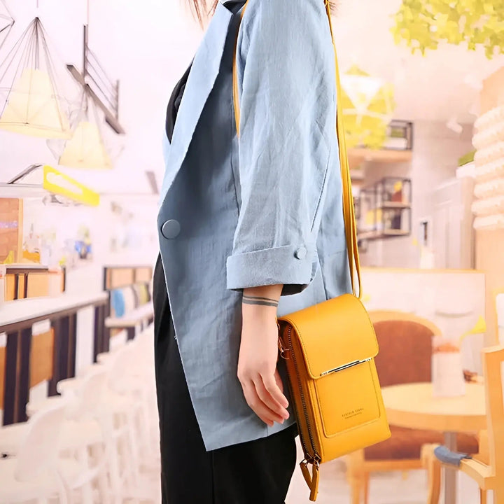 Close-up of anti-theft leather shoulder bag highlighting RFID protection for secure cards.