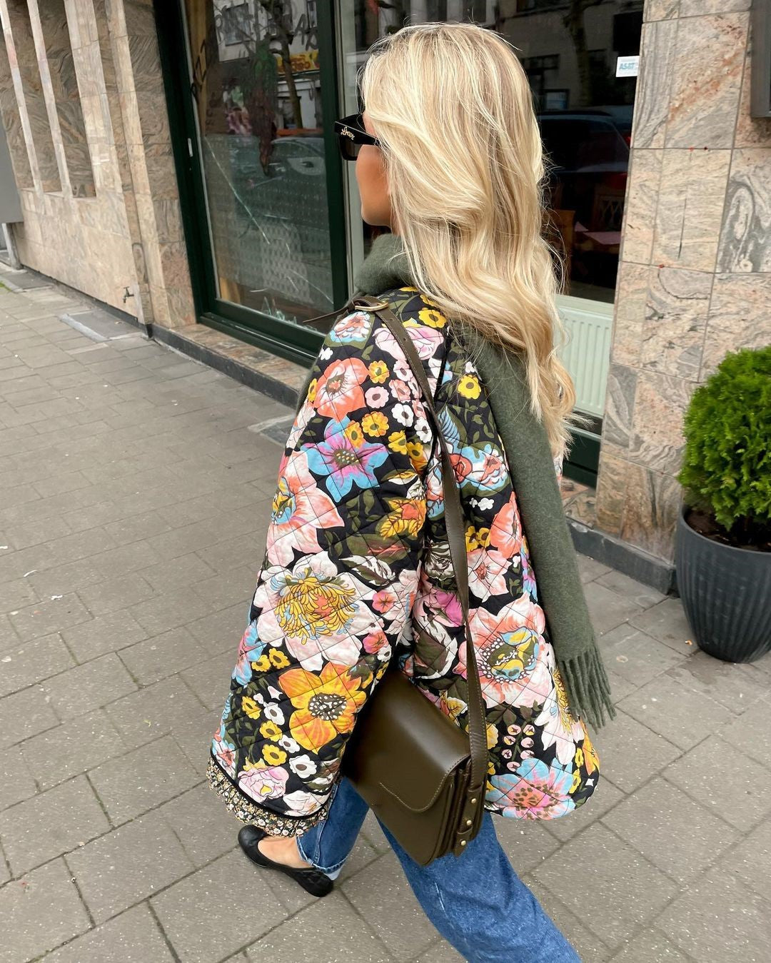 Trendy women's Aurora padded jacket with a beautiful floral design. A fashionable and warm winter coat.