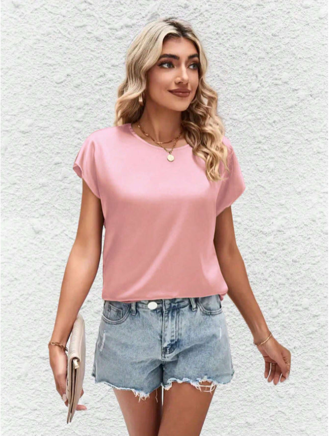 Fashionable women's batwing sleeve blouse, round neck design. Perfect for a chic casual summer look.