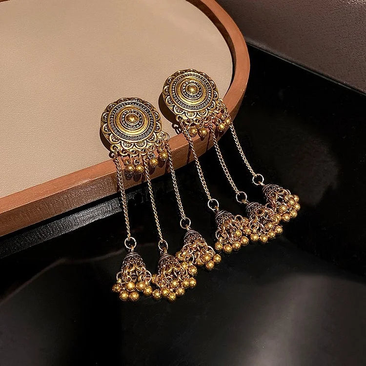 Pair of Noura boho ethno pendant earrings for women. Unique, stylish bohemian jewelry.