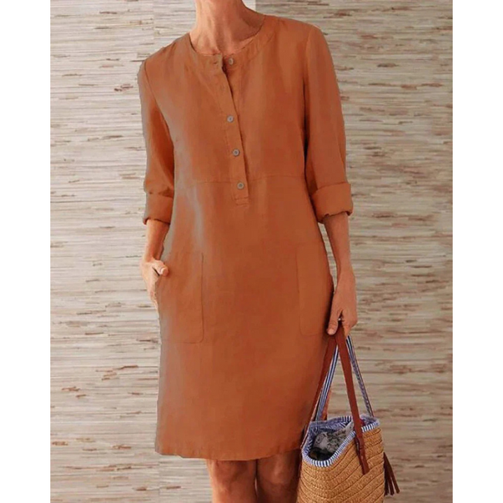 Women's stylish casual dress, knee-length with pockets & round neck. Comfortable long sleeve design for everyday wear.