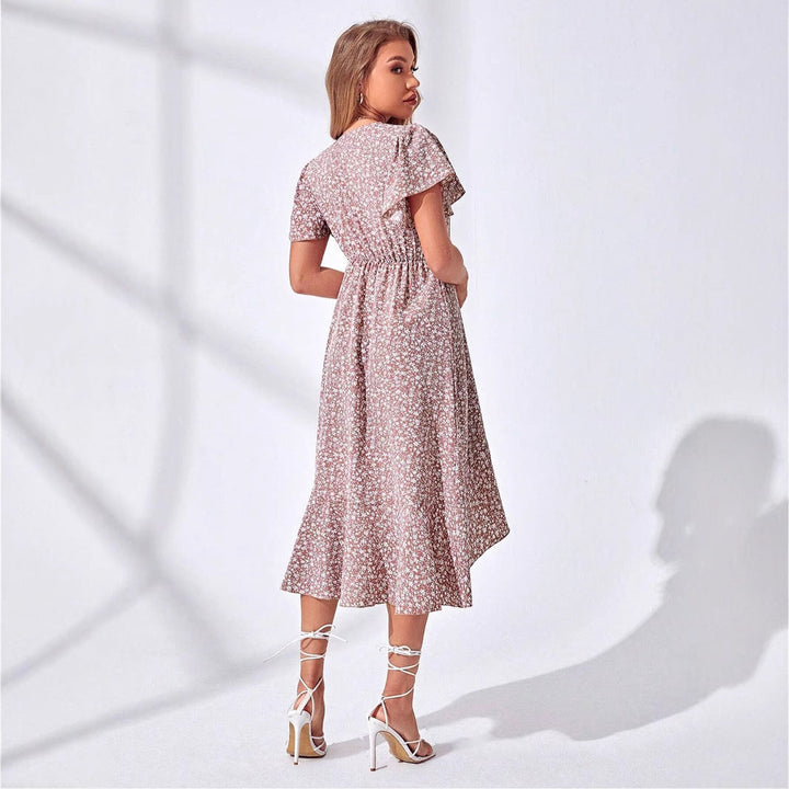 Lightweight floral wrap summer dress for women. Features a playful ruffled V-neck, ideal for casual everyday fashion.