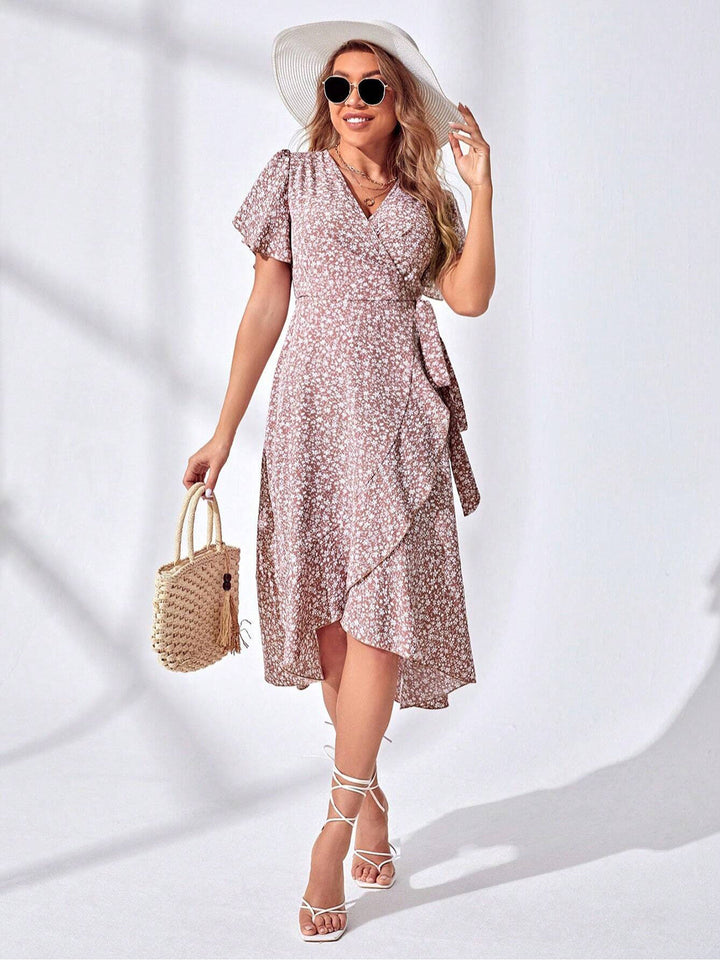 Vibrant women's floral wrap summer dress, featuring a flattering V-neck and ruffles. Ideal vacation outfit or casual wear.