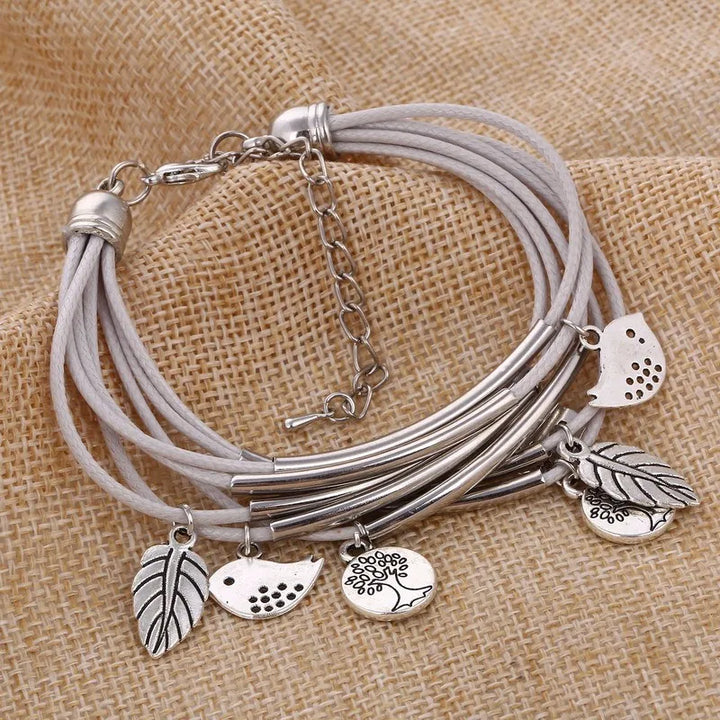 Chic white layered leather bracelet for women, an adjustable multi-strand fashion accessory.