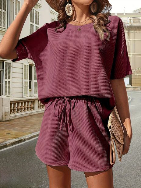 Stylish & comfortable women's summer top & shorts set, perfect for casual elegance and comfort.