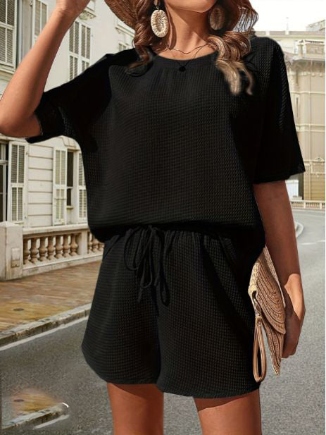 Perfect women's vacation outfit: lightweight summer top & shorts set for beachwear or resort.