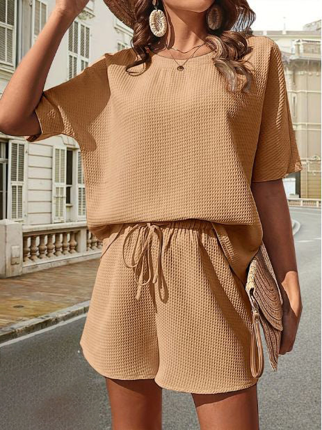 Essential women's summer shorts set with a relaxed fit top & elastic waist shorts for ease.
