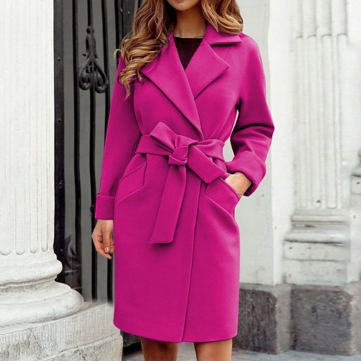 Close-up of an elegant women's long trench coat. Stylish and warm winter jacket, premium outerwear.