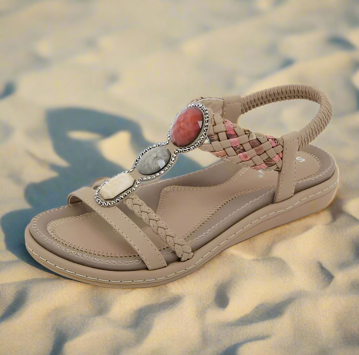 Comfortable low heel women's sandals, ideal for casual beach days or relaxing vacation wear. Ergonomic support.