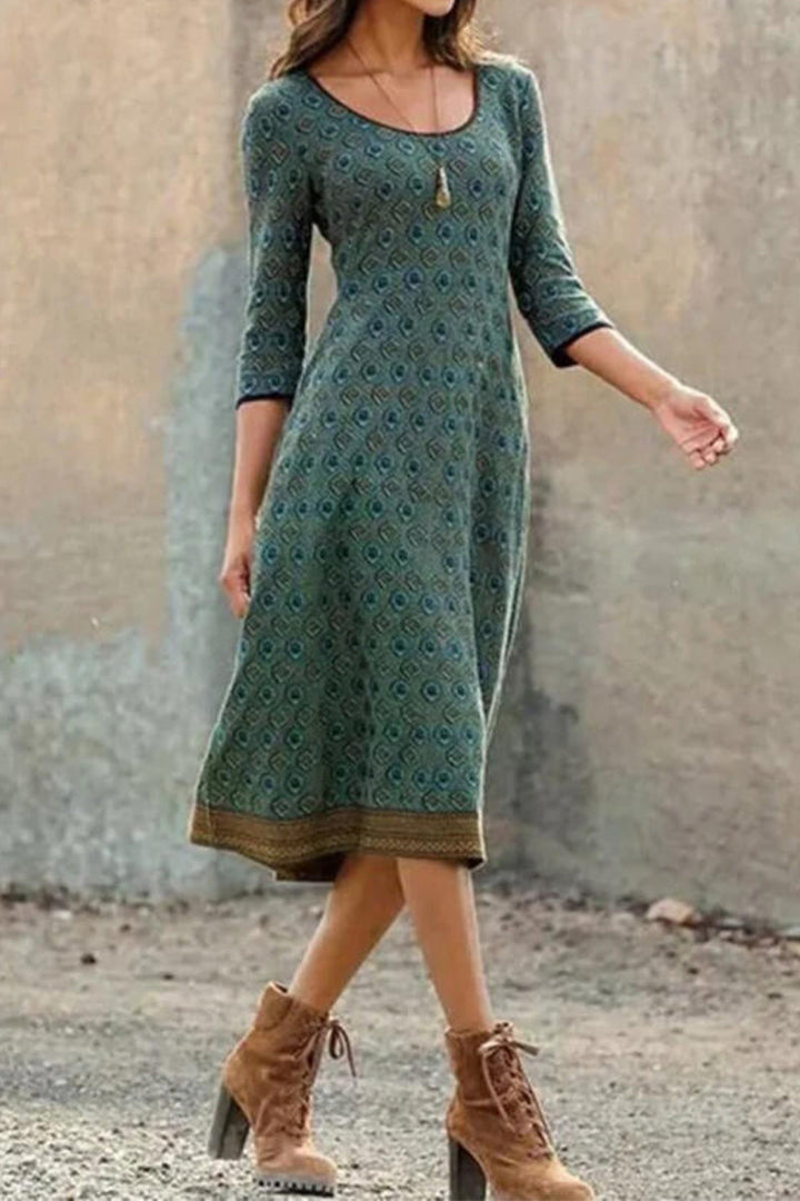 Stylish women's midi dress with half sleeves & geometric print. Perfect A-line summer fashion or casual elegant wear.