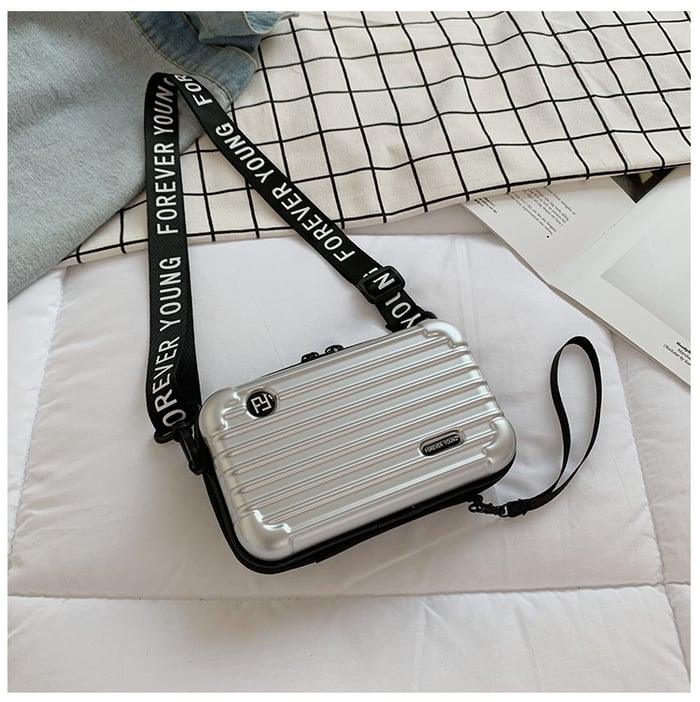 Durable polyester mini travel bag for women, a compact & stylish shoulder companion.