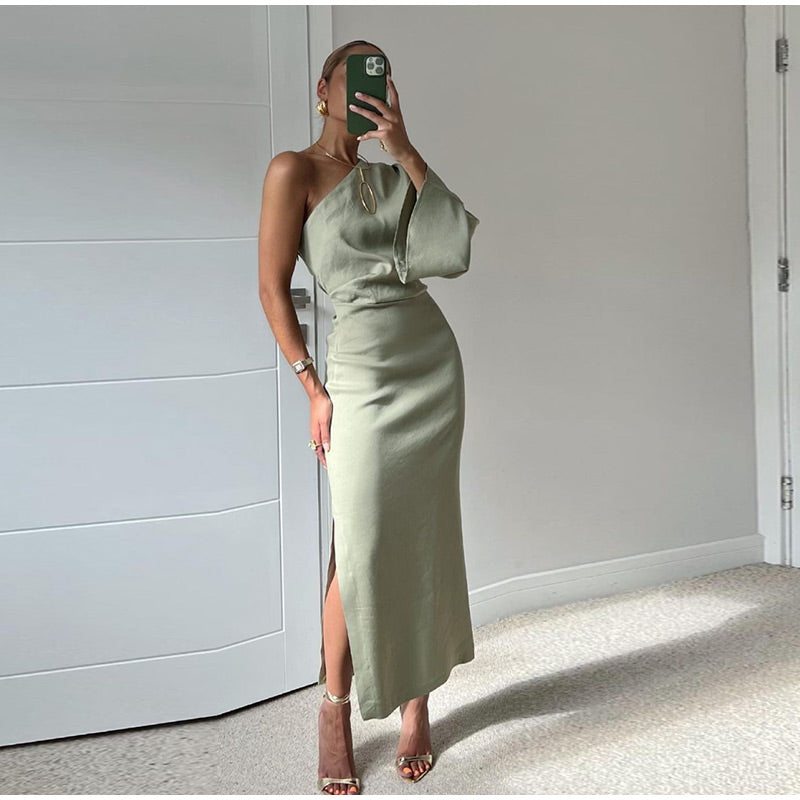 Stylish women's one-shoulder pleated midi dress for casual or party wear. Elegant long sleeve design for fashionable events.