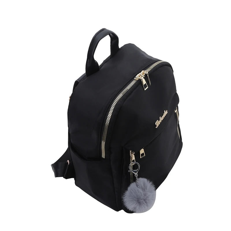 Fashionable woman carrying a black PU leather travel backpack, ideal for urban exploration & stylish outings.