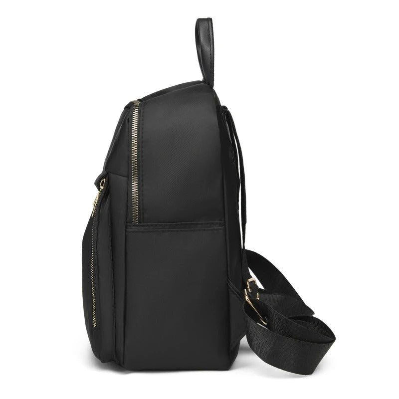 Elegant black women's PU leather travel backpack with multiple compartments for organized storage on the go.