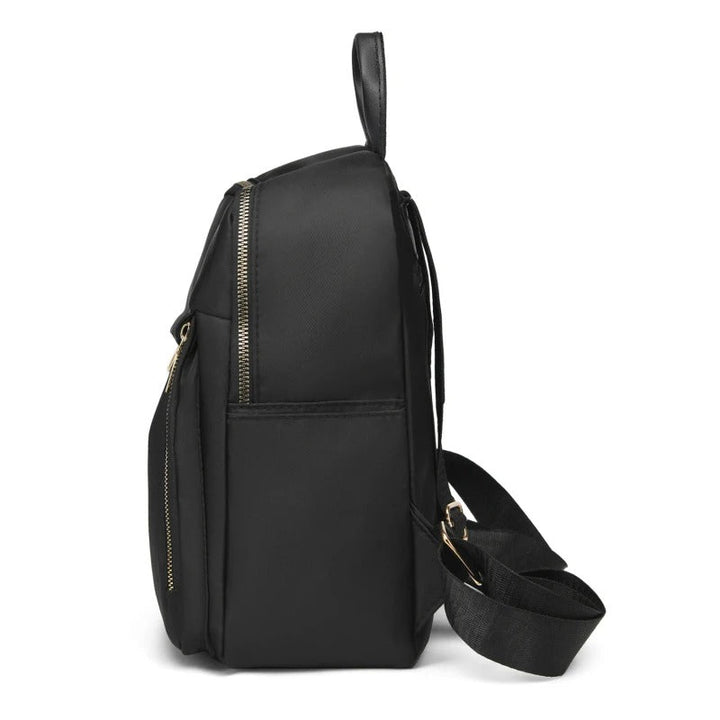Elegant black women's PU leather travel backpack with multiple compartments for organized storage on the go.