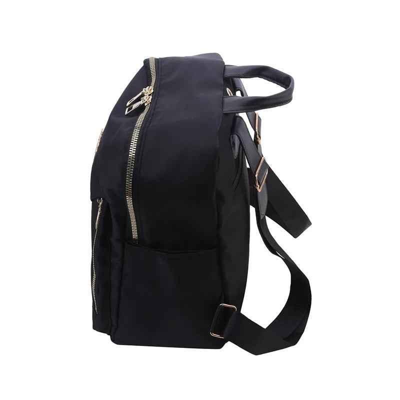 Close-up of durable PU leather texture & sleek design details on a modern women's travel backpack.