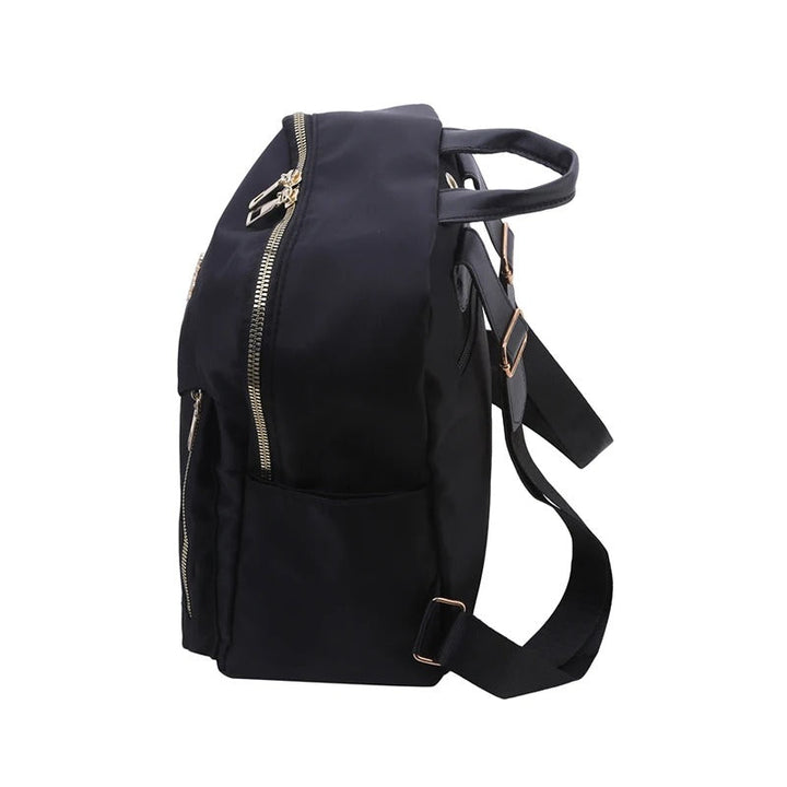 Close-up of durable PU leather texture & sleek design details on a modern women's travel backpack.