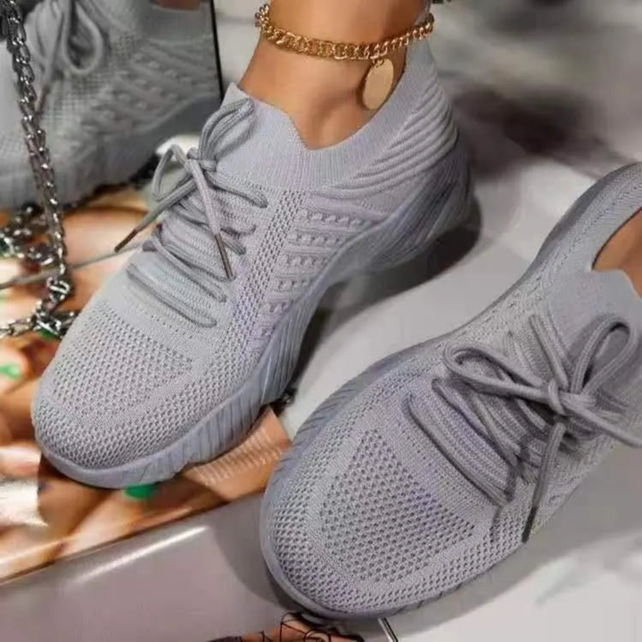 Casual women's fashion sneakers. Breathable chunky design with lace-up closure for comfortable summer walking.