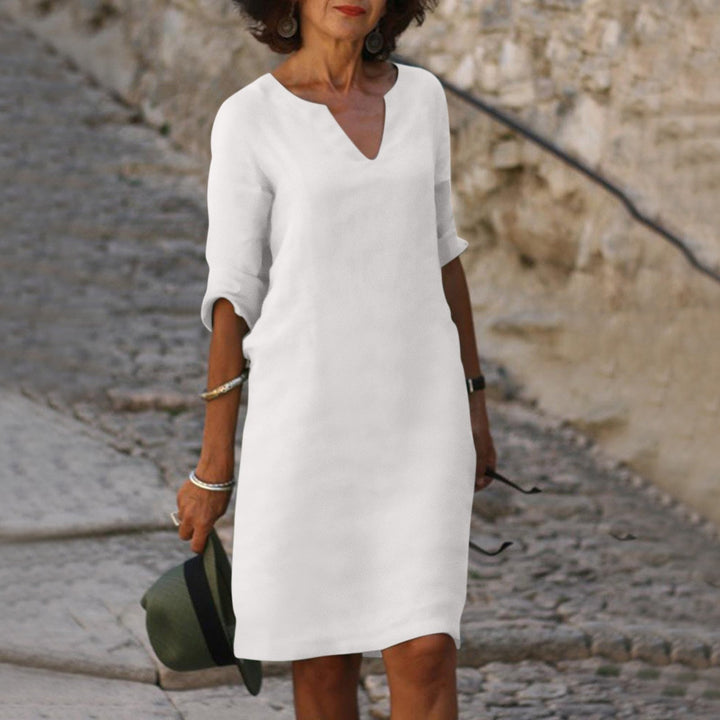 Woman enjoying a sunny day in a stylish, comfortable & versatile women's summer dress.