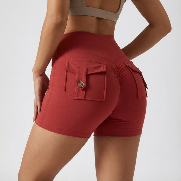 Pair of grey high-waisted athletic shorts for women with spacious pockets, suitable for fitness apparel.