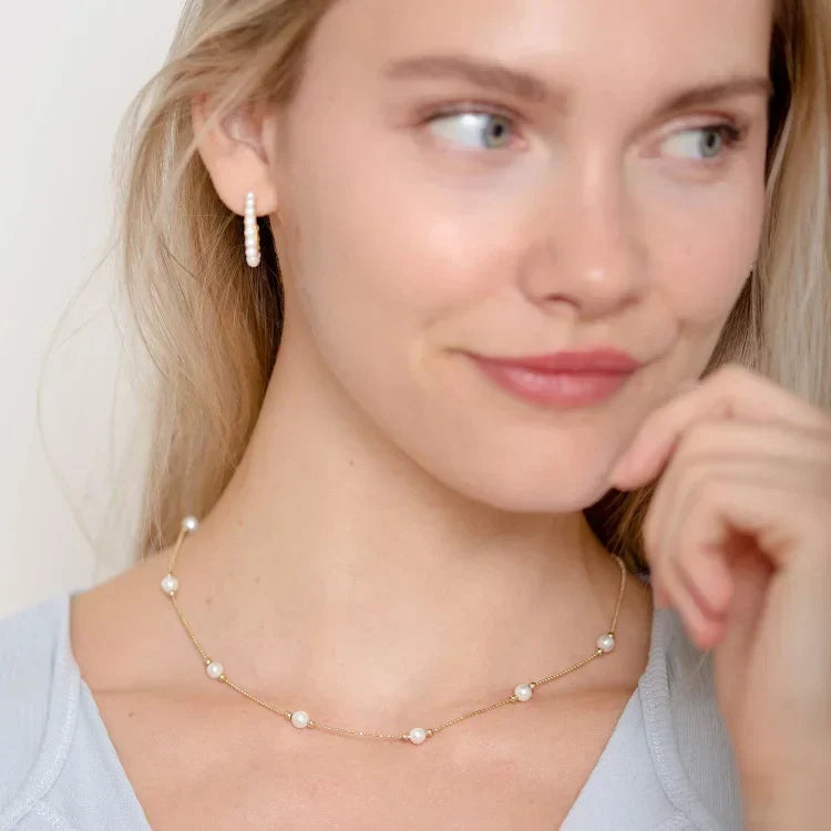 Beautiful women's golden pearl necklace, a timeless and elegant piece of classic jewelry for her.