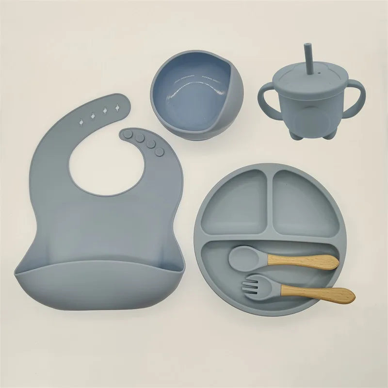 Durable BPA-free silicone baby feeding set, non-slip suction plate, bowl & soft utensils.